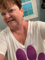 LES SECRETARY SHOWS HER PURPLE PRIDE