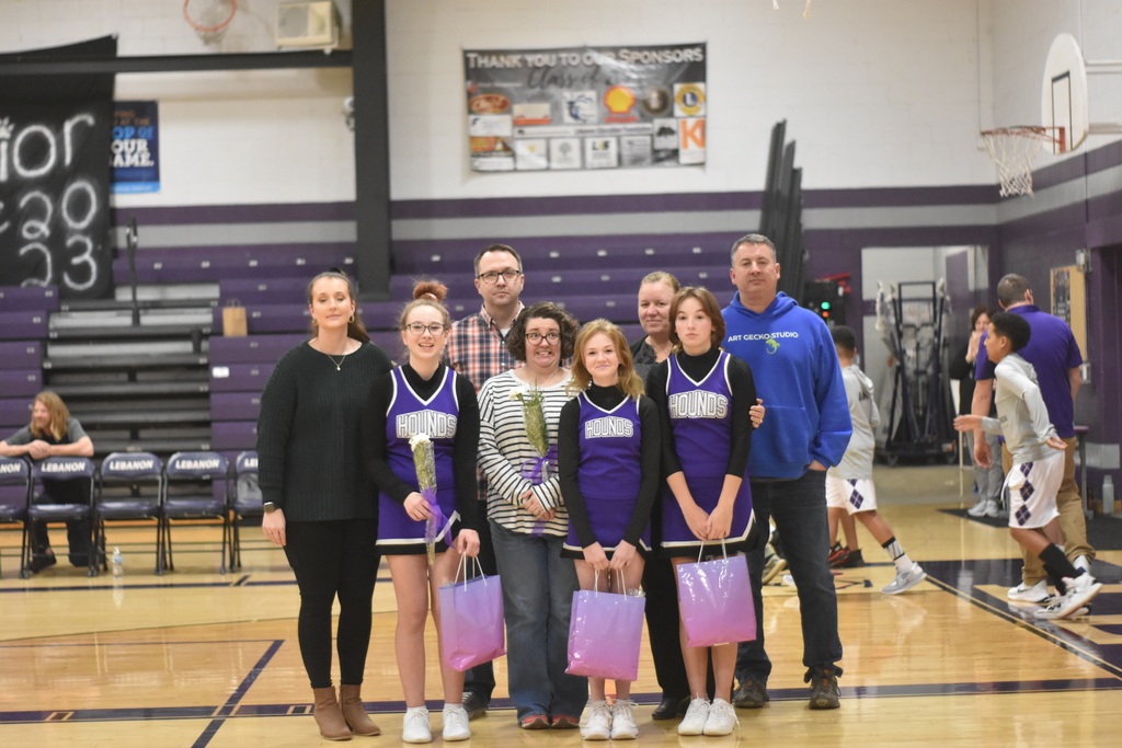 8th grade night cheerleaders with parents